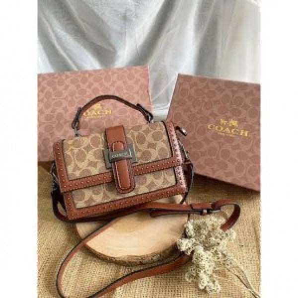 Coaach studded flap sling bag with box