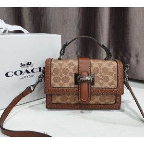 Coaach studded flap sling bag with box