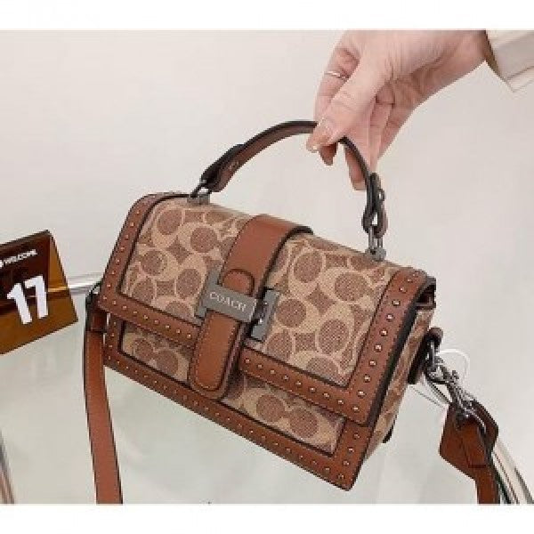 Coaach studded flap sling bag with box