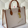 Miichael korrs tote bag with dust cover