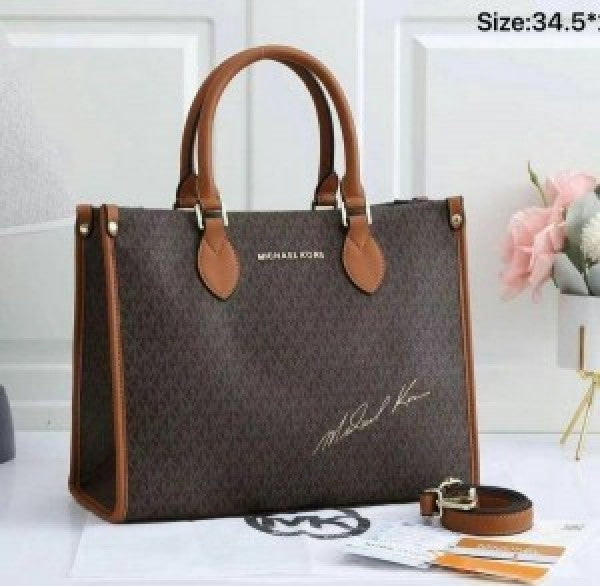 Miichael korrs tote bag with dust cover