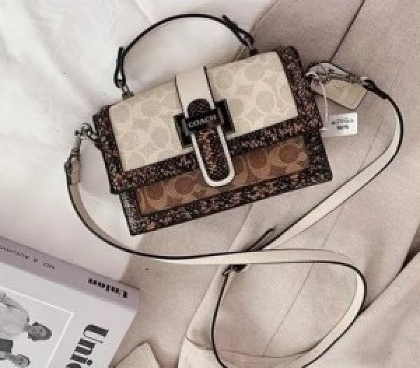 Coaach studded flap sling bag with box