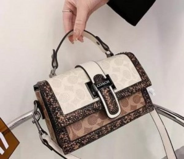 Coaach studded flap sling bag with box