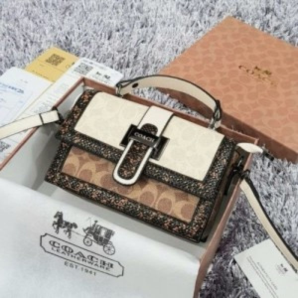 Coaach studded flap sling bag with box