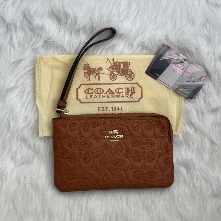 Coachh Emboss Wristlet With DustCover
