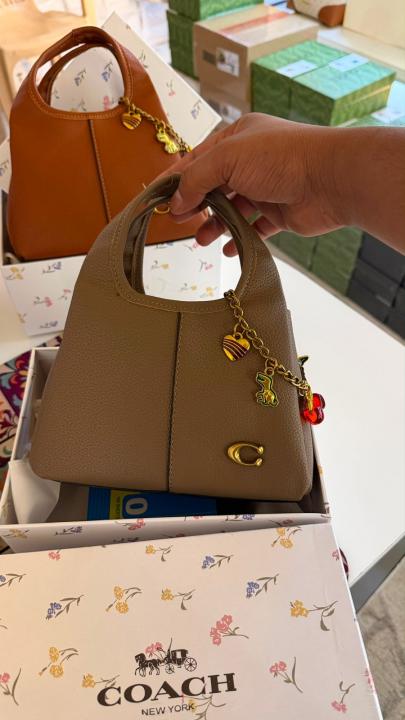 Coaach lana hobo sling bag with charm and premium quality with box